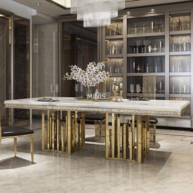 Mesa de comedor rectangular moderna de m&aacute;rmol dorado con sillas